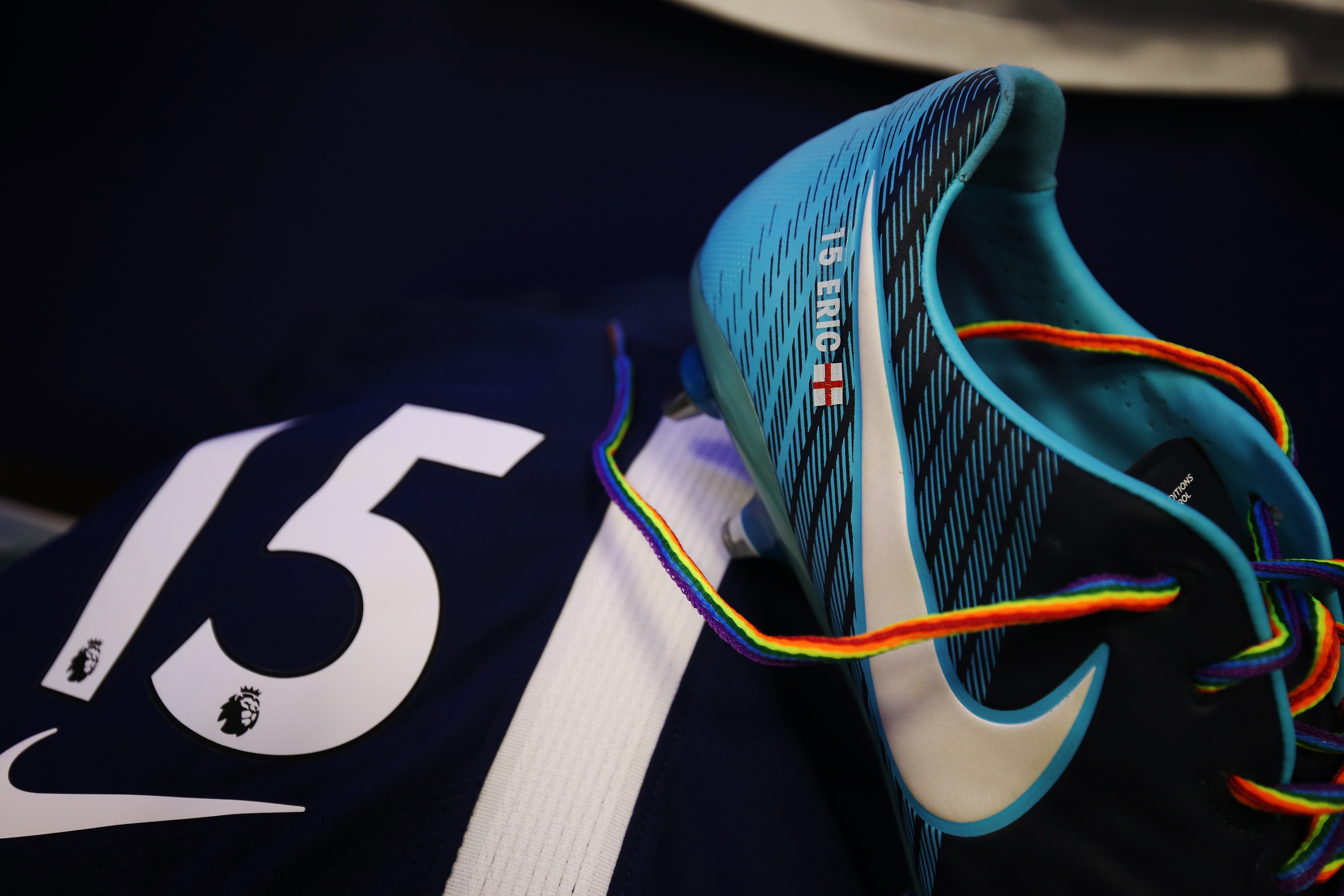 Photo displays a football boot with rainbow laces.